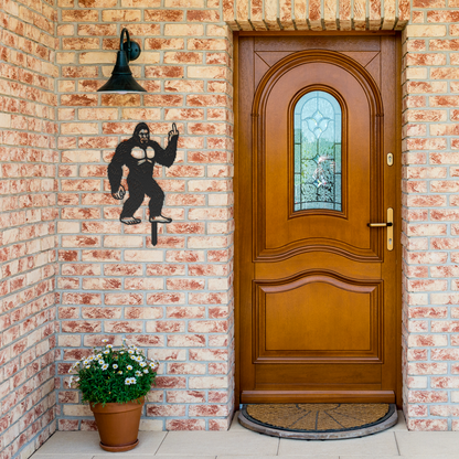 Bigfoot_Metal_Garden_Stake_Flipping_Off__Black_Brick_Entrance_Mockup.png
