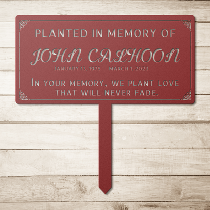 Memorial sign installed in landscaped garden in copper finish